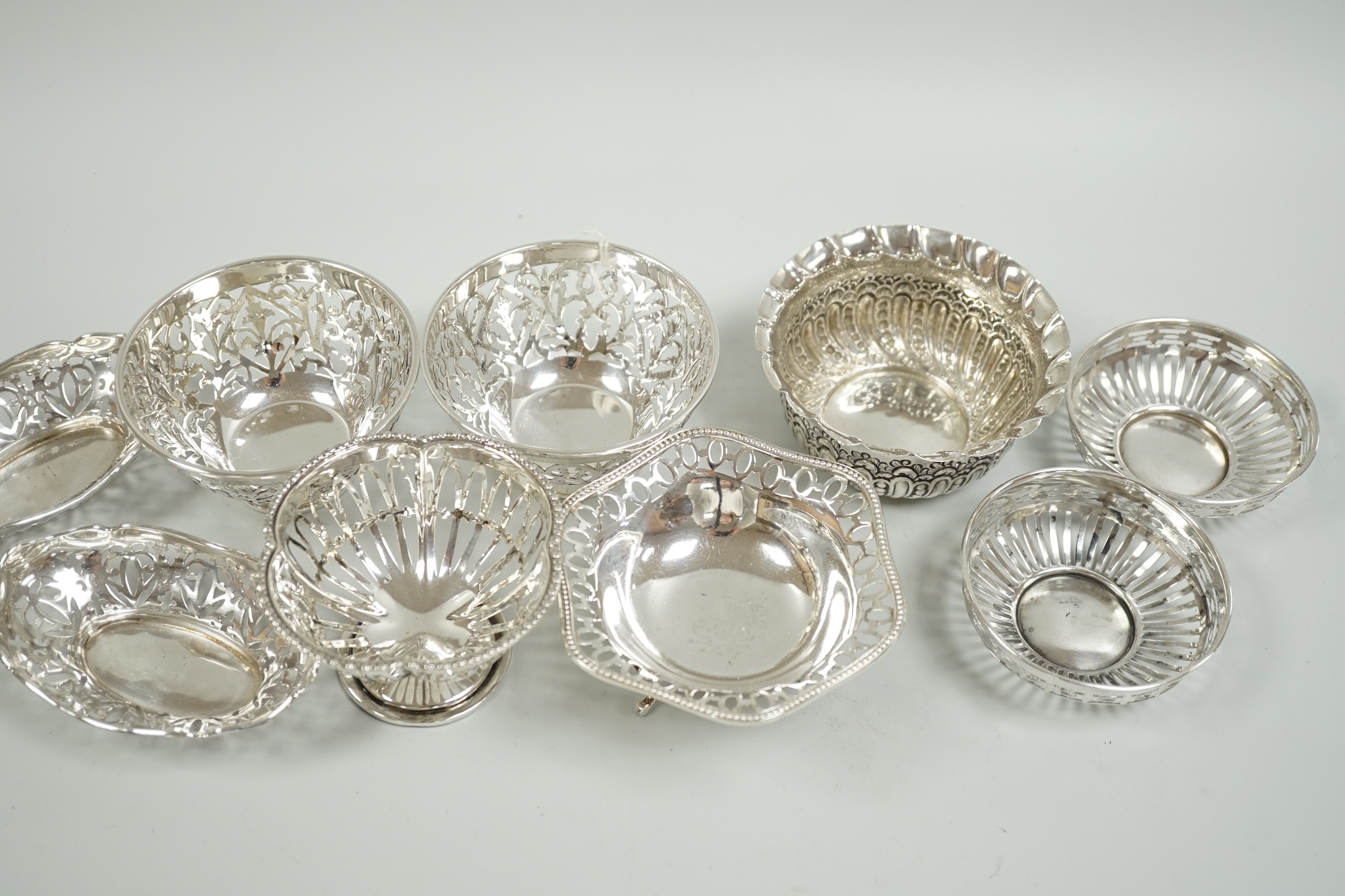 A modern pair of pierced silver sweetmeat bowls, by C.J. Vander Ltd, diameter 84mm, a pair of earlier bonbon dishes and four other silver bowls, 15.9oz.